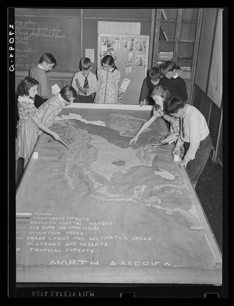 Greenbelt schoolchildren studying map. Greenbelt, Maryland. Sourced from the Library of Congress.