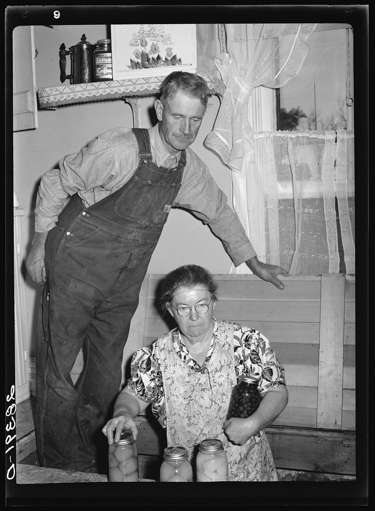 Mr. and Mrs. Milton Robinson, FSA (Farm Security Administration) borrowers, in their farmhouse near Greenley. Weld County…