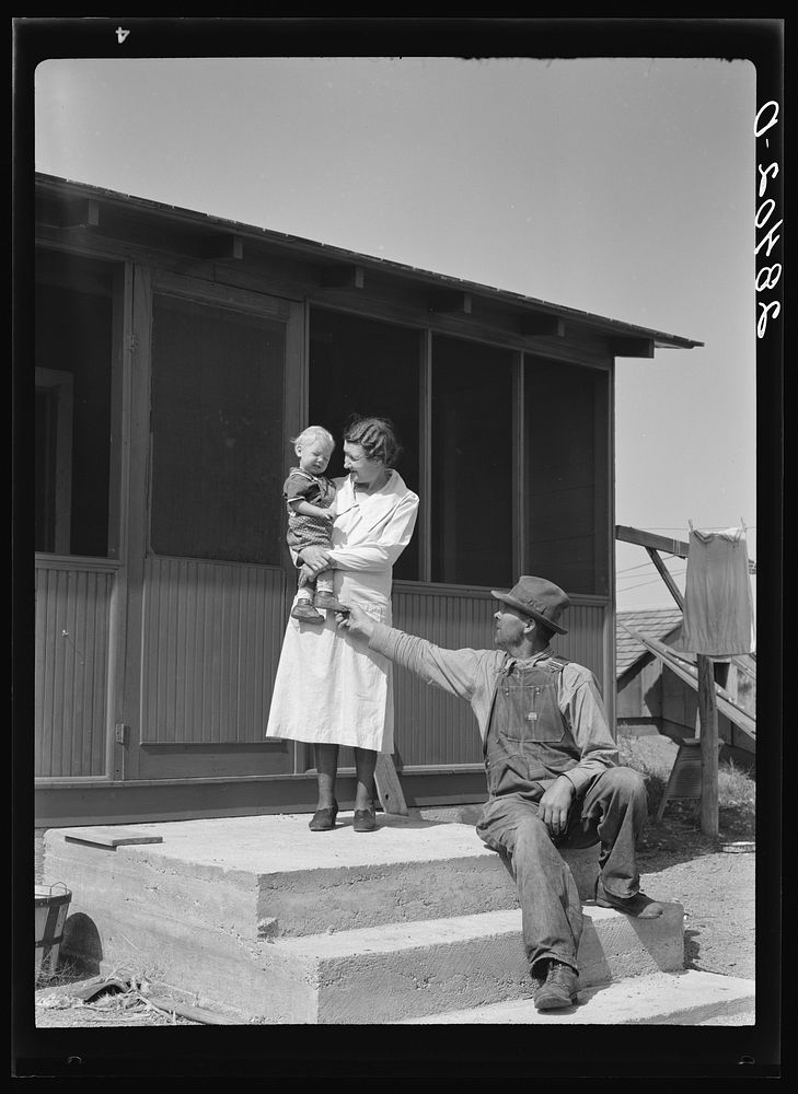 Mr. and Mrs. Calvin Brown and grandson on the steps of their house near Eaton, Colorado. FSA (Farm Security Administration)…