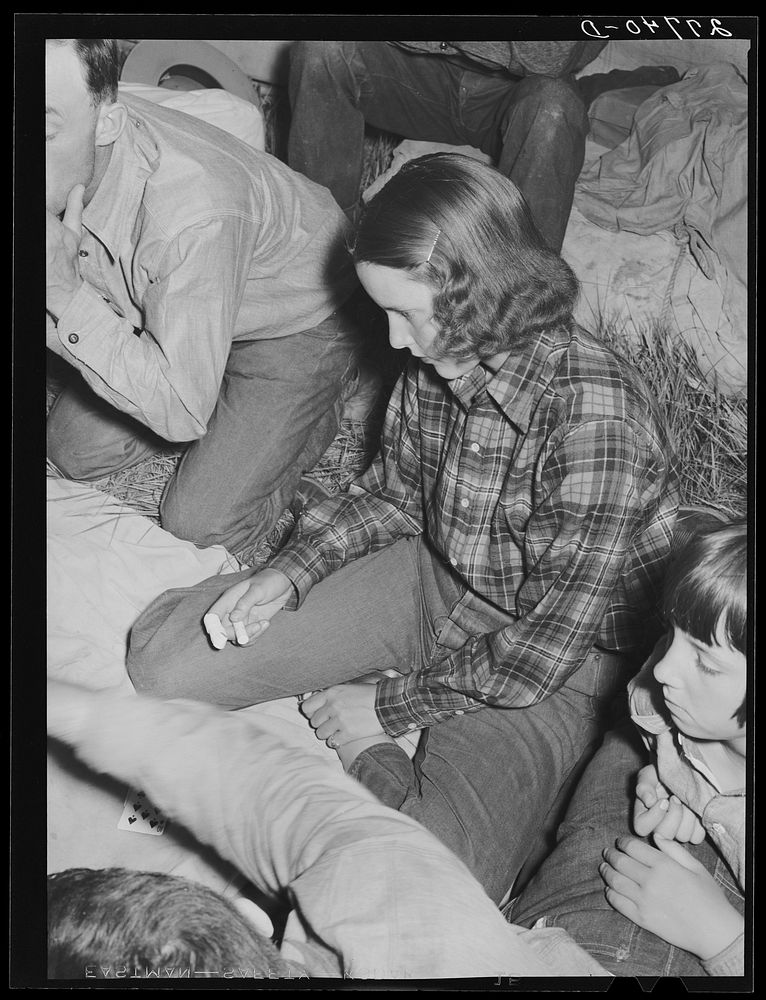 Dude girl in poker game. Quarter Circle 'U' Ranch, Montana. Sourced from the Library of Congress.