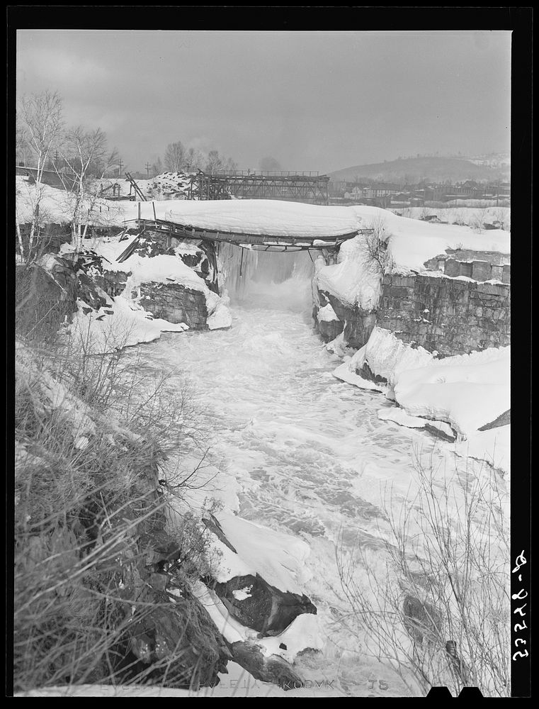 Bridge weighted down by heavy snowfall in Berlin, New Hampshire. Sourced from the Library of Congress.