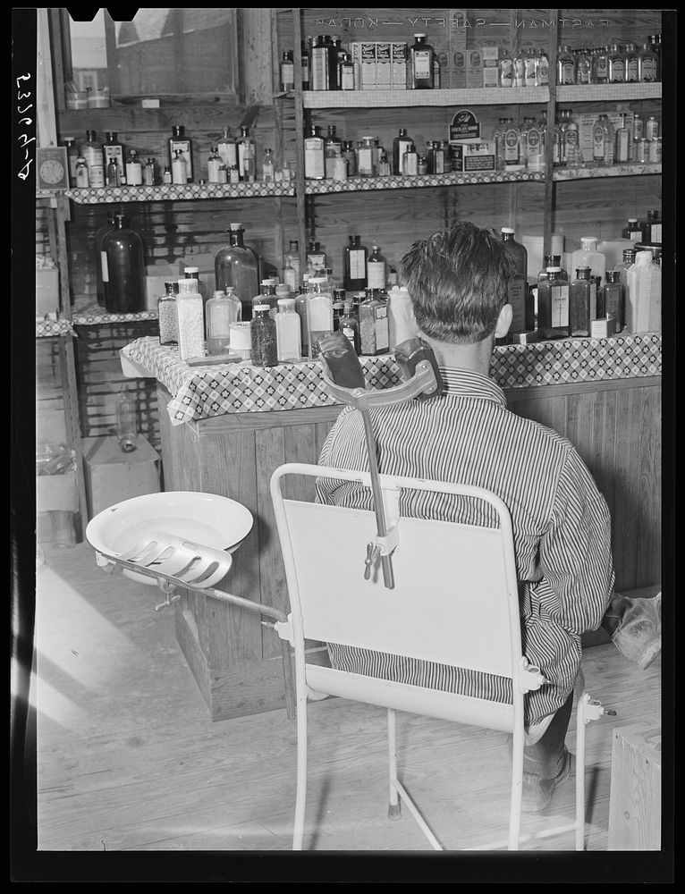 Patient waiting in the doctor's office, rear of country store. Faulkner County, Arkansas. Sourced from the Library of…