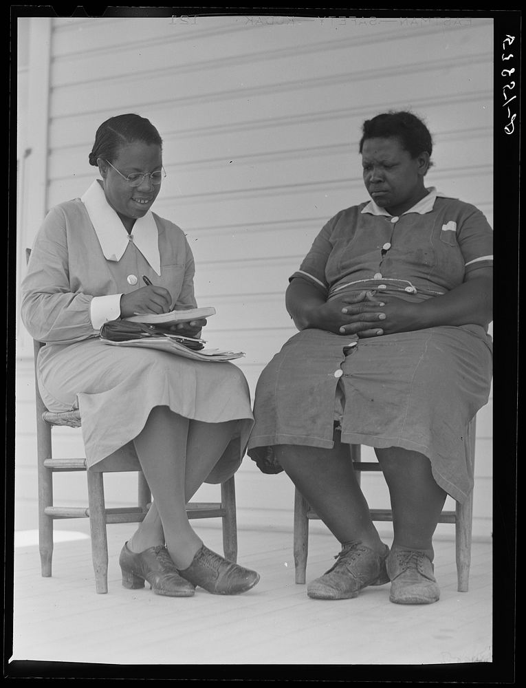 Nurse Marguerite White making plans for next meeting with Rosie Patterson, assistant secretary of Busy Bee home workers club…
