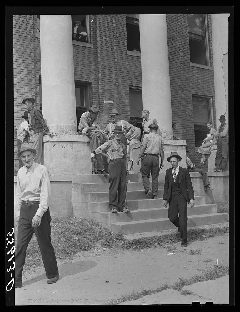 Mountain people and farmers exchanging news and greetings on court day on the steps of the courthouse. Campton, Wolfe…