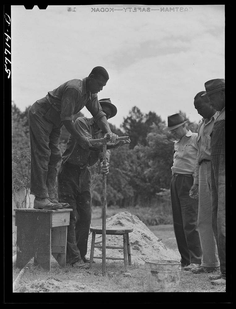 Boring a well to replace an open dug well. Bored well demonstration. Saint Mary's County, Ridge, Maryland. Sourced from the…