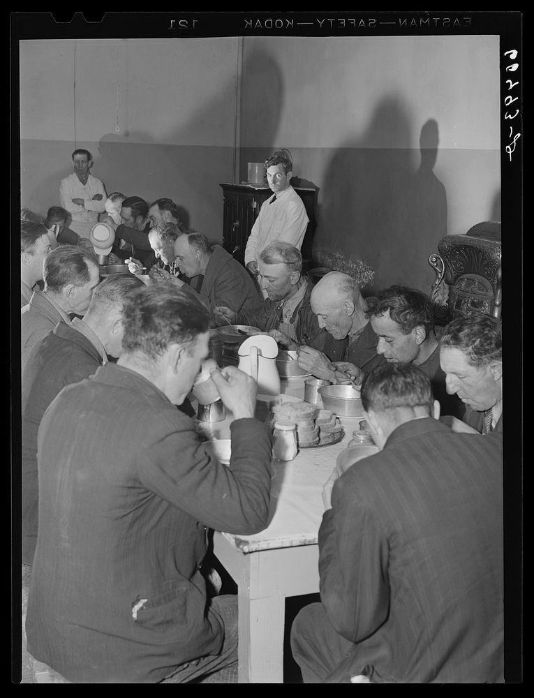 Evening meal served at Dubuque city mission. Dubuque, Iowa. Sourced from the Library of Congress.