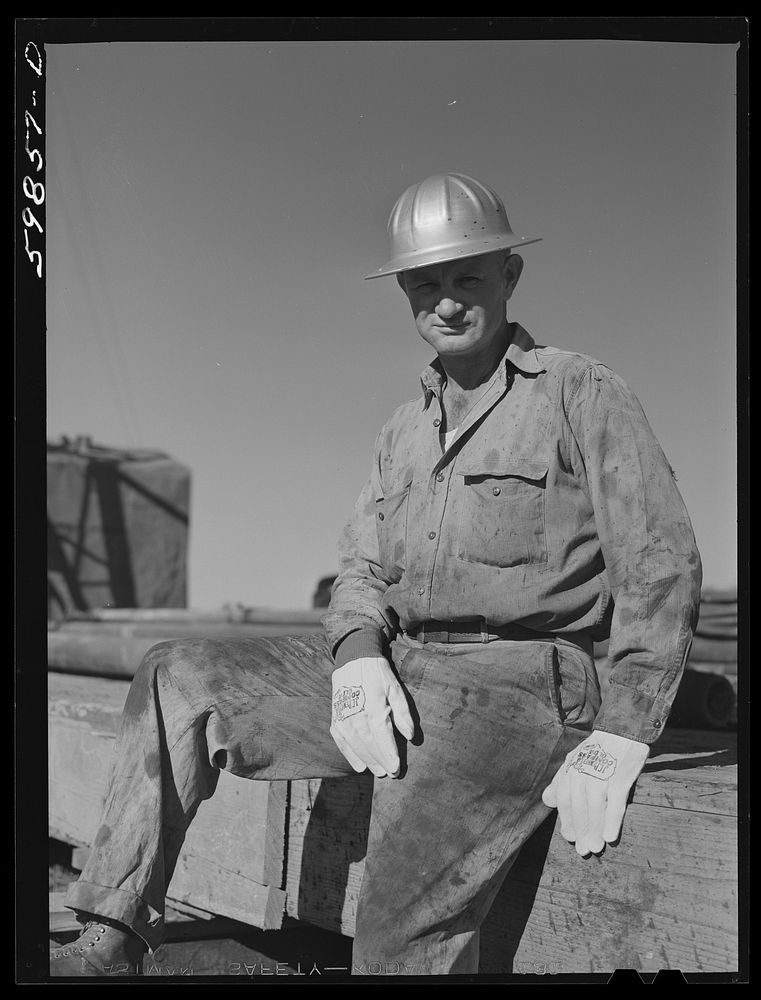 T.J. Schenermann, driller from Oklahoma. Worked in Kansas oil fields about fifteen years. By oil well being drilled in…