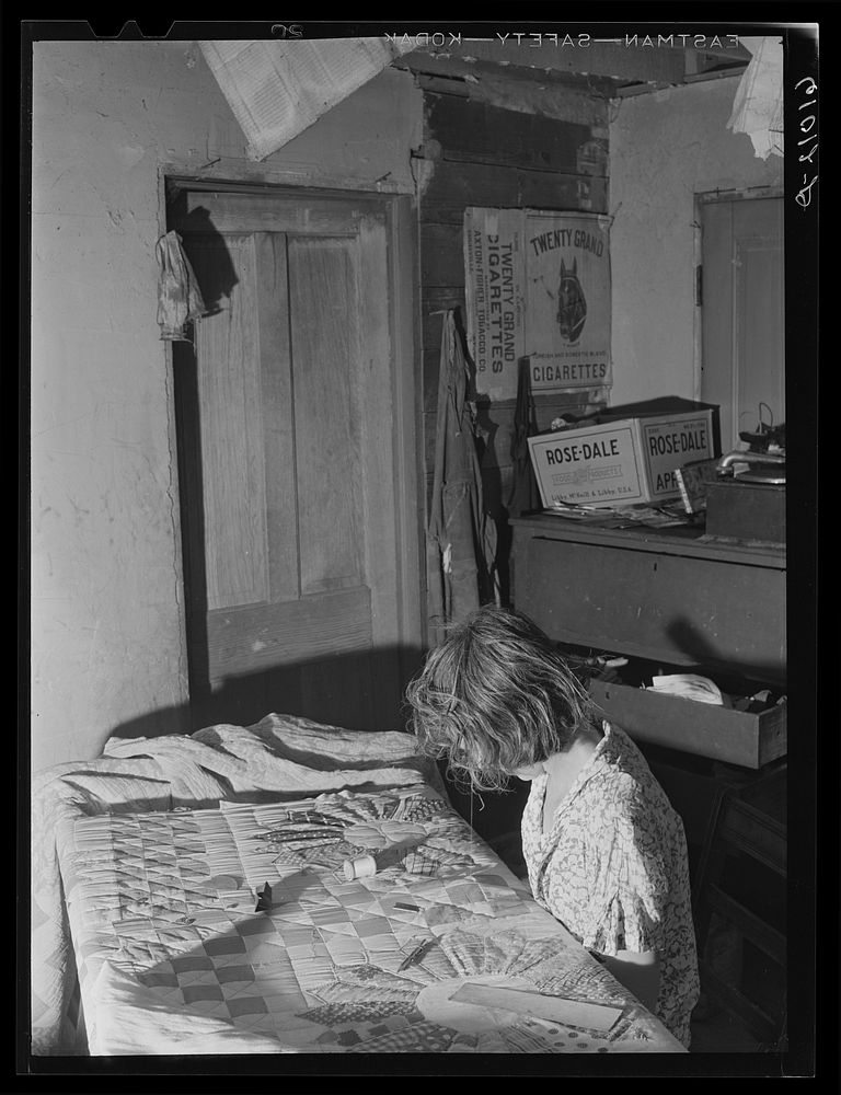 Wife of FSA (Farm Security Administration) rehabilitation borrower sewing a quilt. Grant County, Illinois. Sourced from the…