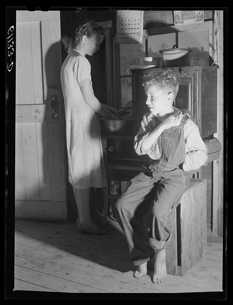 Interior of one-room cabin occupied by migrant fruit pickers and packing house workers. Berrien County, Michigan. Sourced…