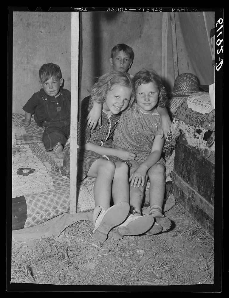 Children of migratory fruit worker in tent home. Berrien County, Michigan. Sourced from the Library of Congress.