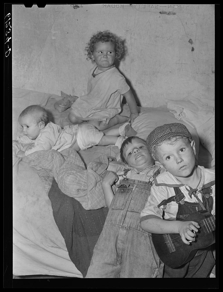 [Untitled photo, possibly related to: Mother, father, and five children sleep in this one room of an abandoned house on…