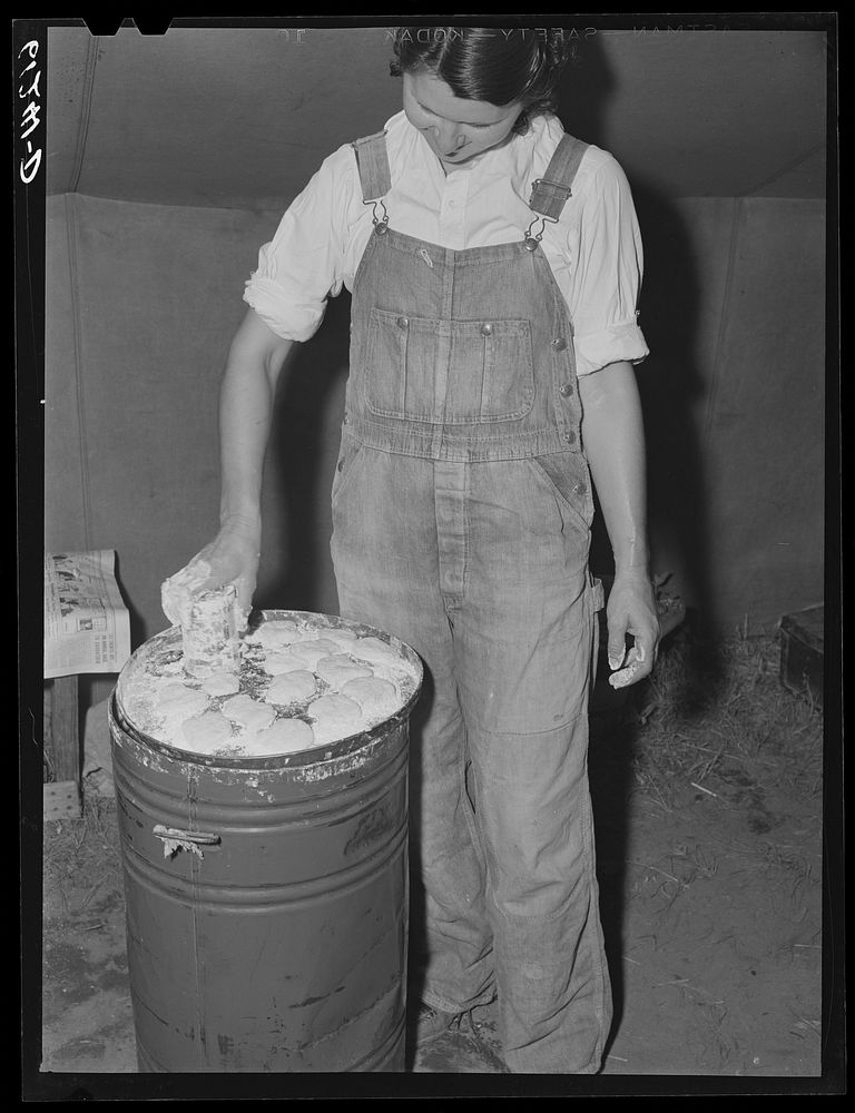 Migrant fruit worker making biscuits in her tent home. Berrien County, Michigan. Sourced from the Library of Congress.