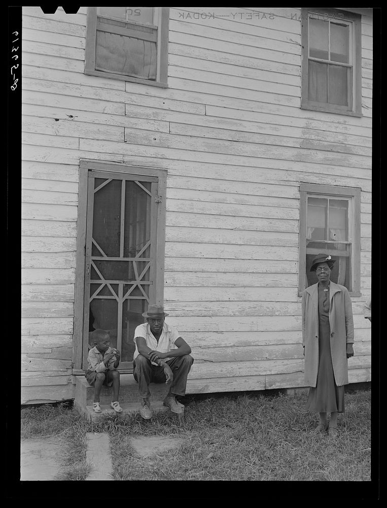 [Untitled photo, possibly related to: John Barnes with his sons in front of their house. He is a FSA (Farm Security…