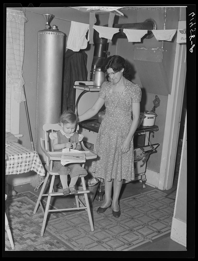 Mrs. Schroeder, wife of FSA (Farm Security Administration) borrower, with daughter. Cavalier County, North Dakota. Sourced…