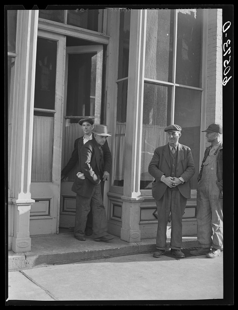 Men coming out of the city mission after evening meal. Dubuque, Iowa. Sourced from the Library of Congress.