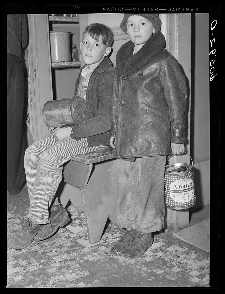 [Untitled photo, possibly related to: Young boys waiting in kitchen of city mission for soup which is given out nightly.…