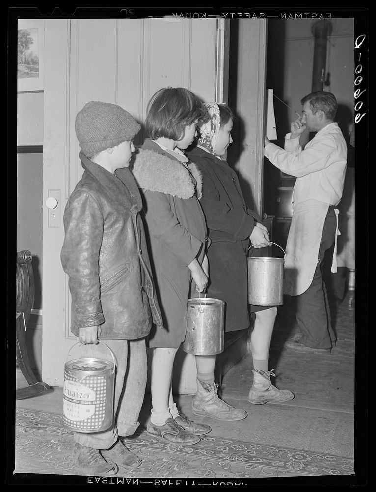 Children waiting in line for soup given out each night by the city mission, a community chest- financed organization.…