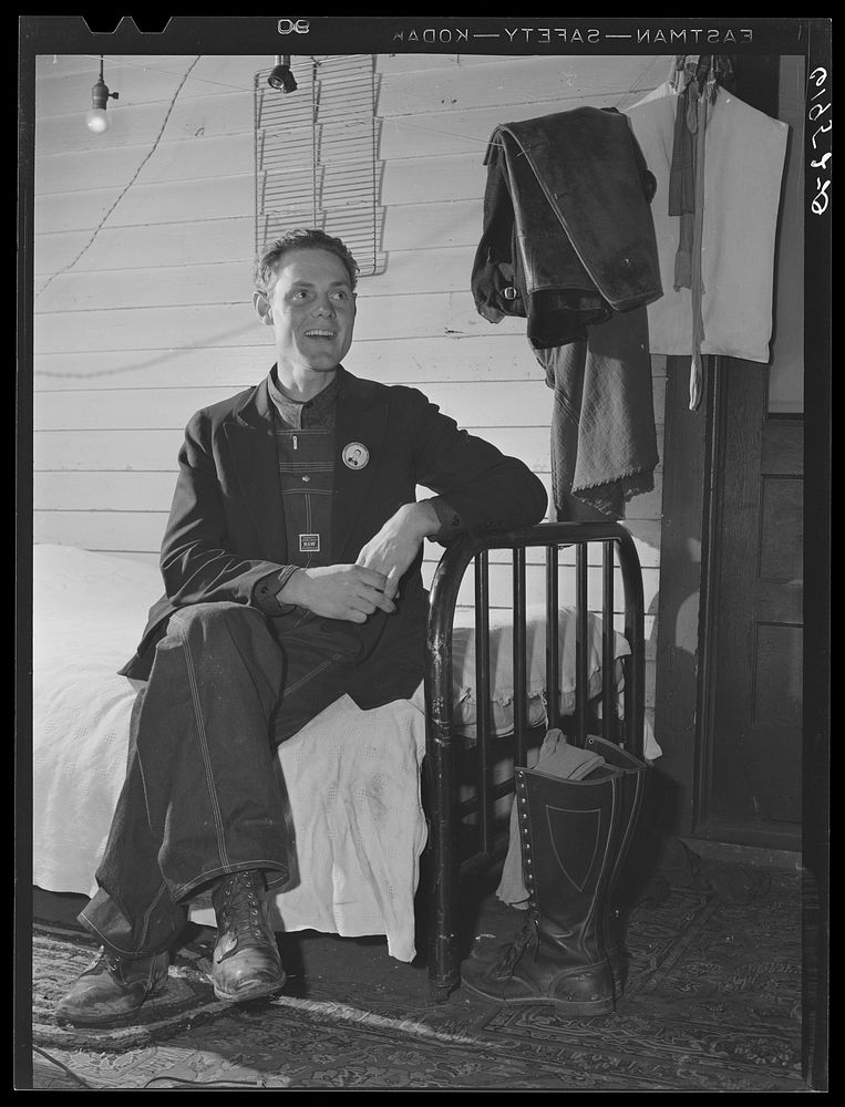 Leo Donathon, laborer at plant, in his improvised bedroom at Mrs. Pritchard's house. Radford, Virginia. Sourced from the…