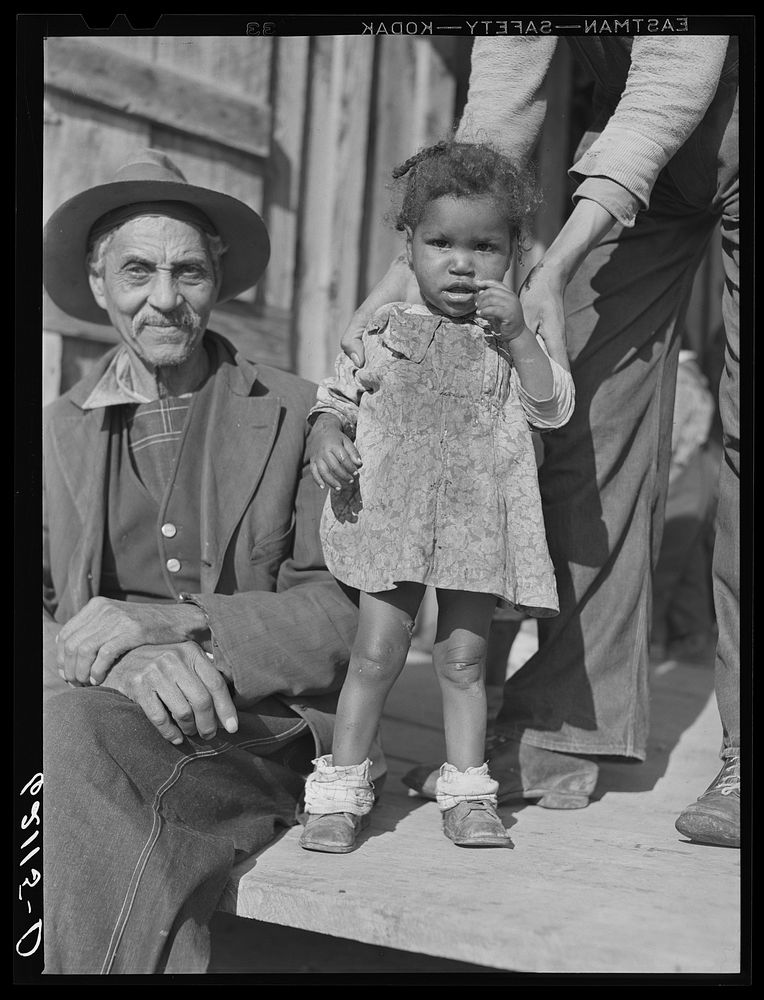 [Untitled photo, possibly related to: Sharecropper and son. Etowah County, Alabama]. Sourced from the Library of Congress.