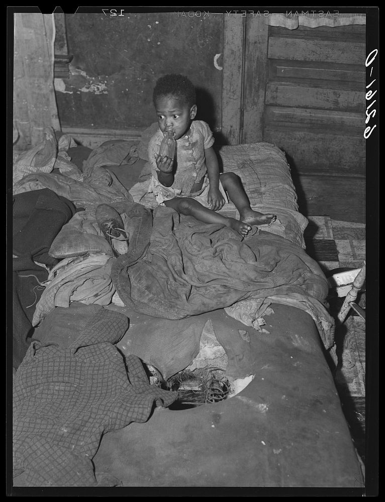 One of five children living with mother in two-room  dwelling. Aliquippa, Pennsylvania. Sourced from the Library of Congress.