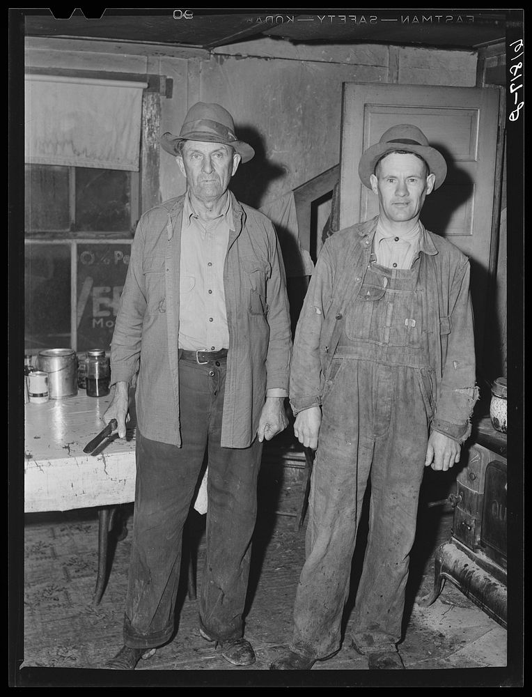 H.C. Richardson and helper. Ozark farmer, earns living on goats and pigs. Oregon County, Missouri. Sourced from the Library…