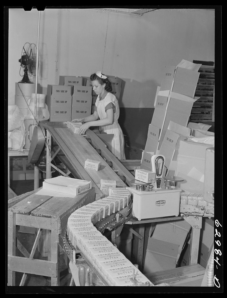 Packing butter at Land O'Lakes plant. Chicago, Illinois. Sourced from the Library of Congress.