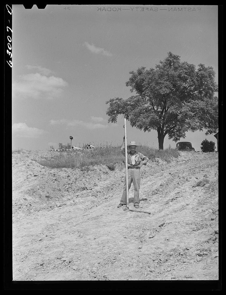 [Untitled photo, possibly related to: Surveyors at work in Martin County, Indiana where naval ammunition depot is being…