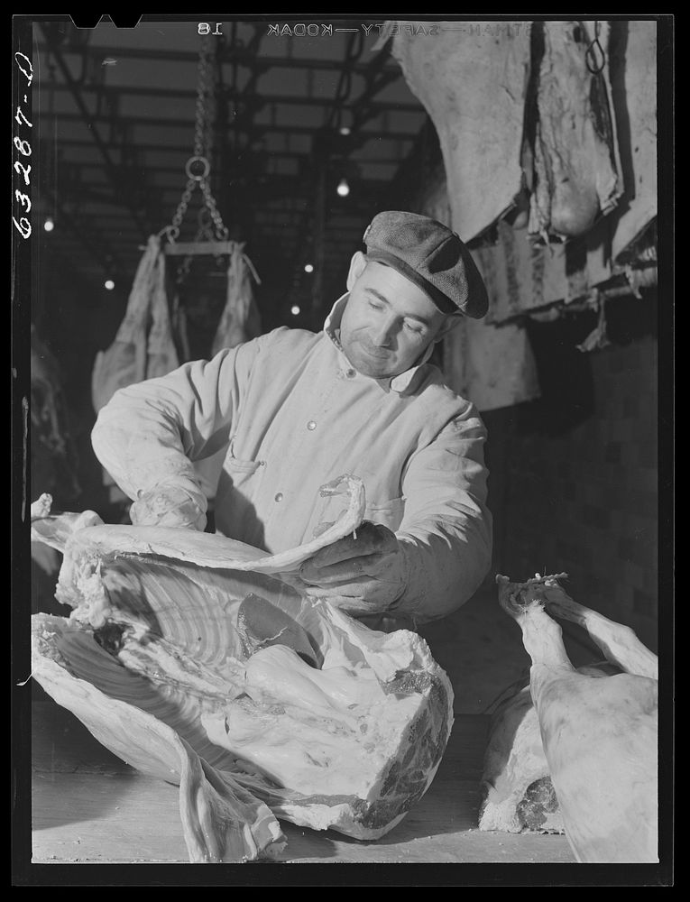 Butcher on the beef cut. Packing plant, Austin, Minnesota. Sourced from the Library of Congress.