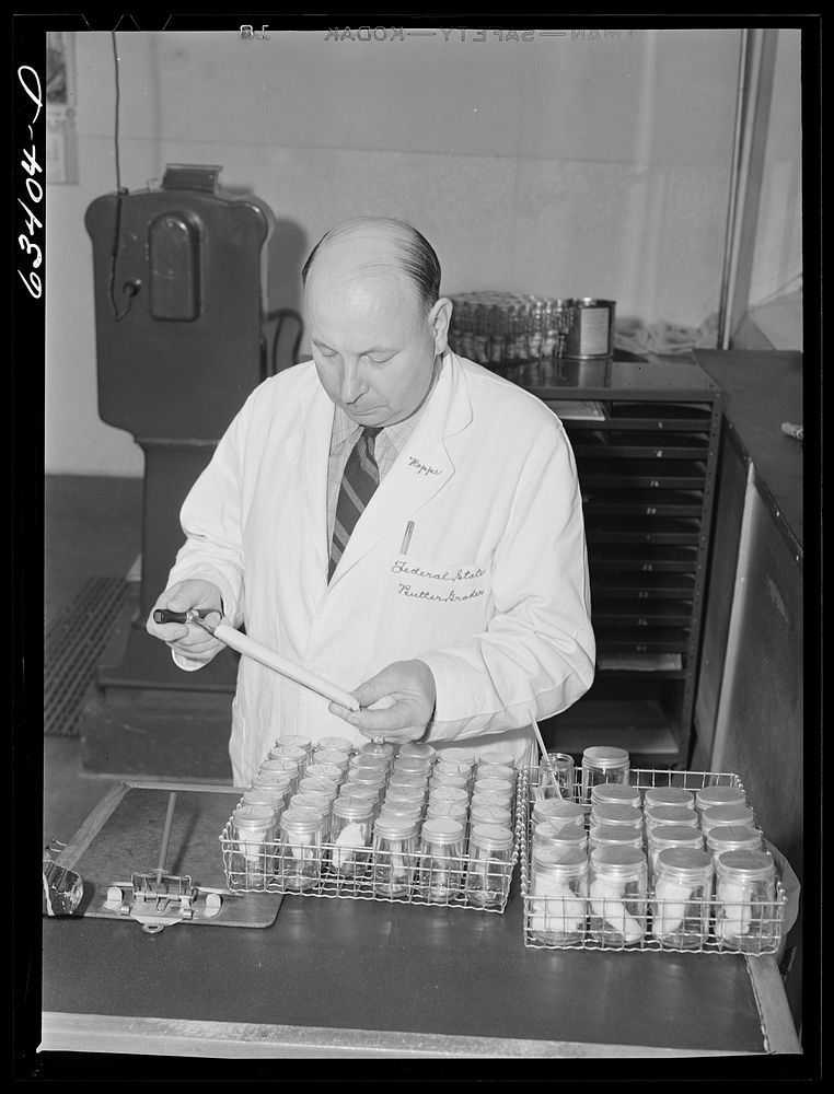 Federal butter inspector. Land O'Lakes plant, Minneapolis, Minnesota. Sourced from the Library of Congress.