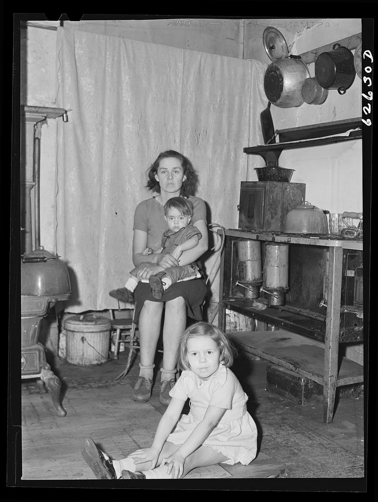 [Untitled photo, possibly related to: Family of defense worker from North Carolina. They live in one-room apartment in…