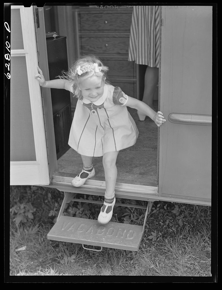 One of Jack Cutter's two children in doorway of trailer home. FSA (Farm Security Administration) camp, Erie, Pennsylvania.…