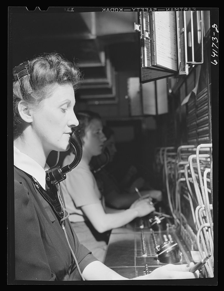 [Untitled photo, possibly related to: Telephone operator at Aberdeen proving grounds. She lives in dormitory for defense…