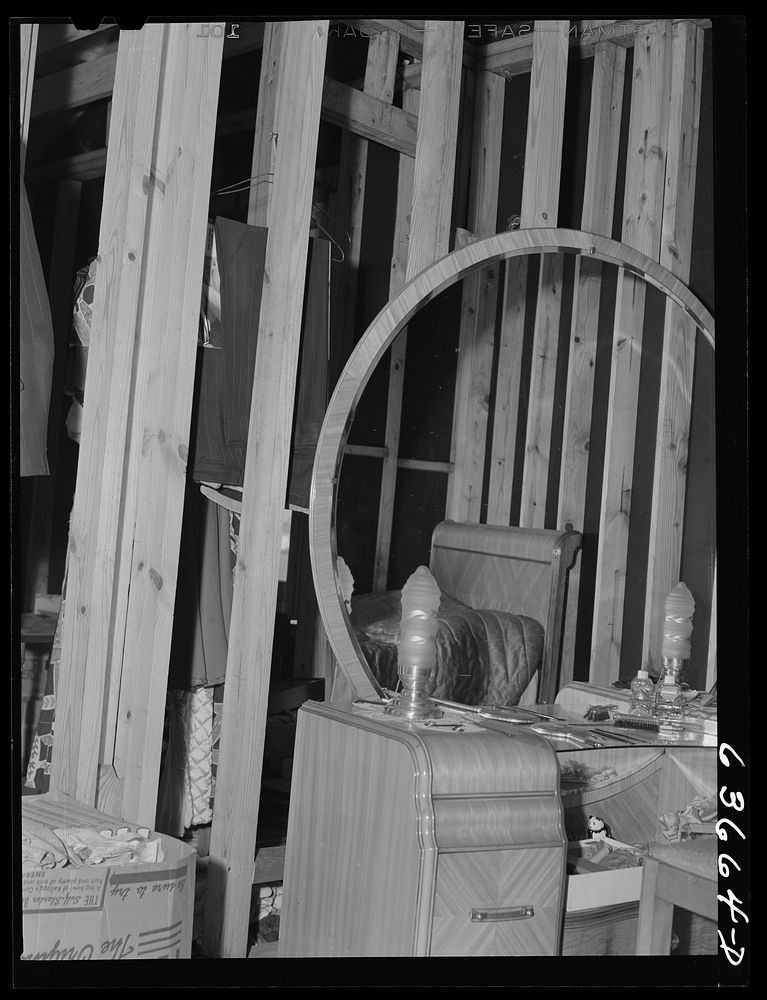 Bedroom furniture in incompleted house going up on outskirts of Detroit, Michigan. Occupied by defense worker and family.…