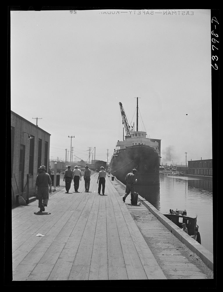 Part of lake boat crew going into town while boat is docked to take on grain. Superior, Wisconsin. Sourced from the Library…