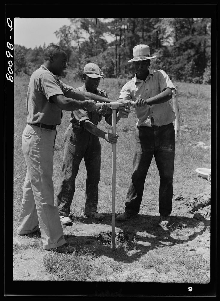 Manpower bores a shallow well if the soil is soft. Ridge well project, St. Mary's County, Maryland. Sourced from the Library…