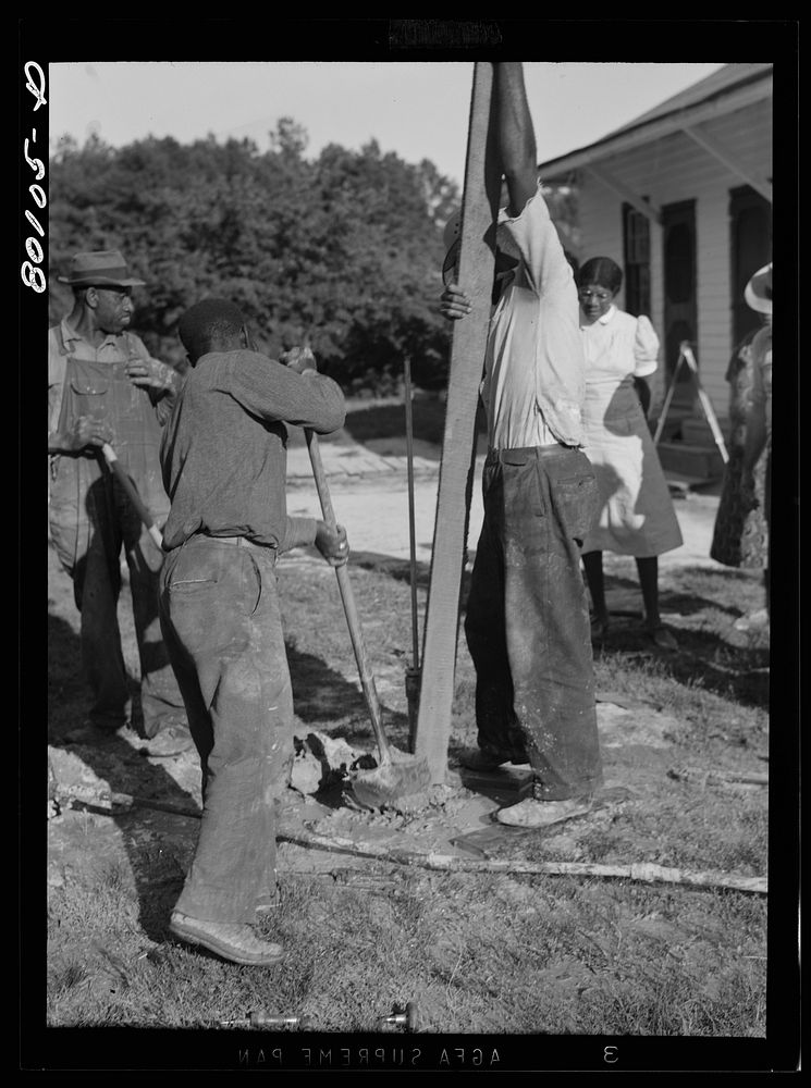 Tamping down gravel fill. Ridge well project, Saint Mary's County, Maryland. Sourced from the Library of Congress.
