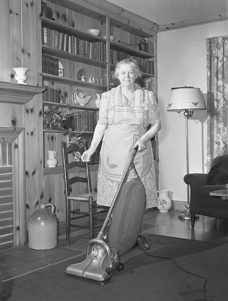 Knox County, Tennessee (Tennessee Valley Authority (TVA)). Mrs. Wiegel uses electric vacuum cleaner. Sourced from the…