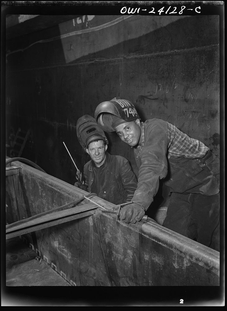 Baltimore, Maryland. Two rod welders helping to build the Liberty ship Frederick Douglass at the Bethlehem-Fairfield…