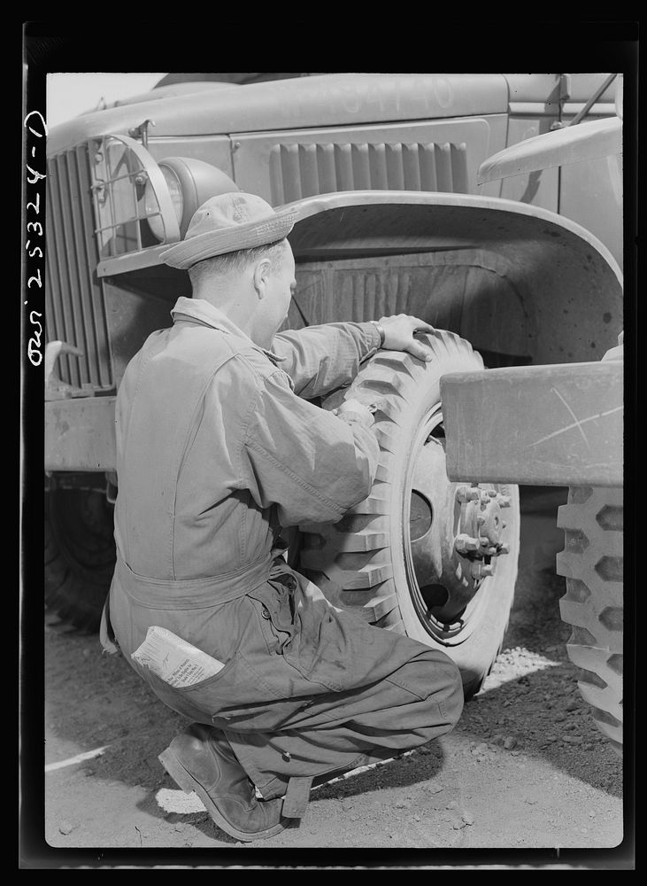 [Untitled photo, possibly related to: Holabird ordnance depot, Baltimore, Maryland. A soldier removing a tack from a United…