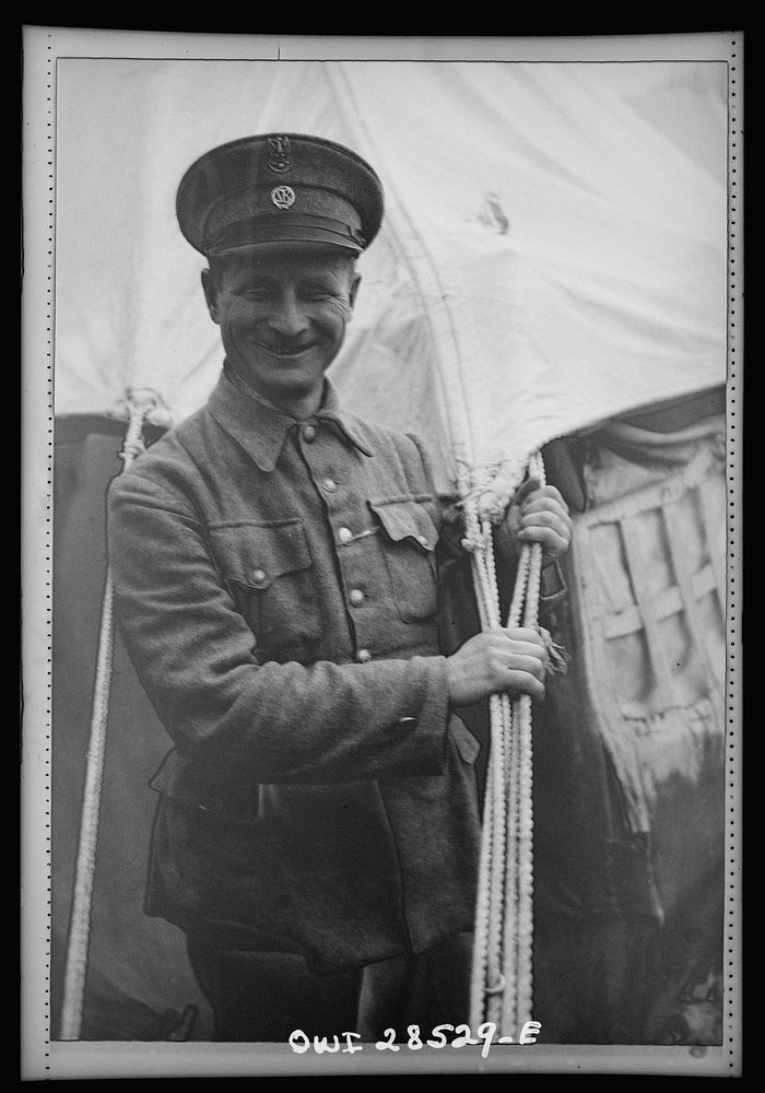 Teheran, Iran. A Polish refugee who is a guard at an evacuee camp operated by the Red Cross. He had worked in Chicago…