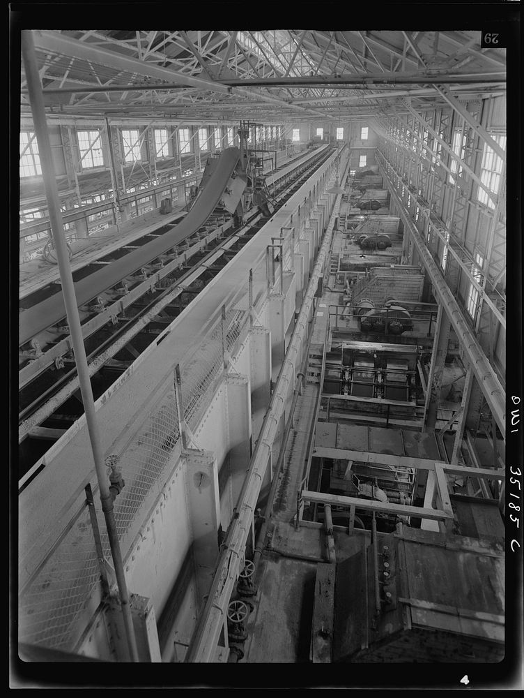 [Untitled photo, possibly related to: A conveyor belt which carried fine copper ore and discharges it into bins at one of…