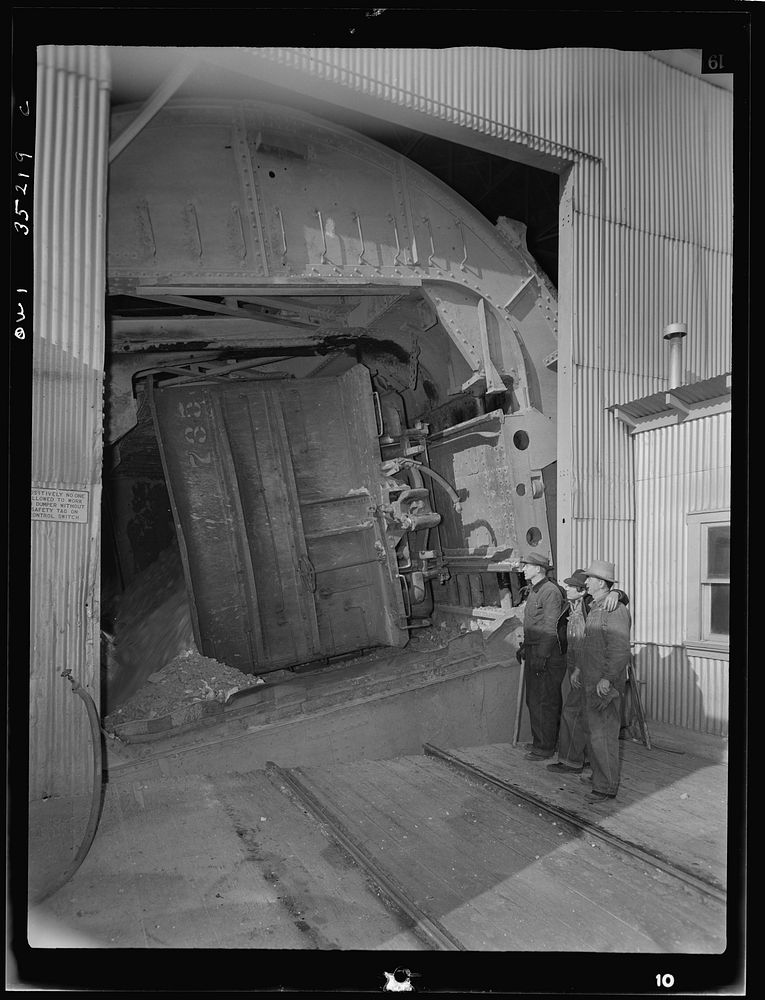 [Untitled photo, possibly related to: Magna, Utah. A rotary car dumper discharging copper ore at the mill]. Sourced from the…