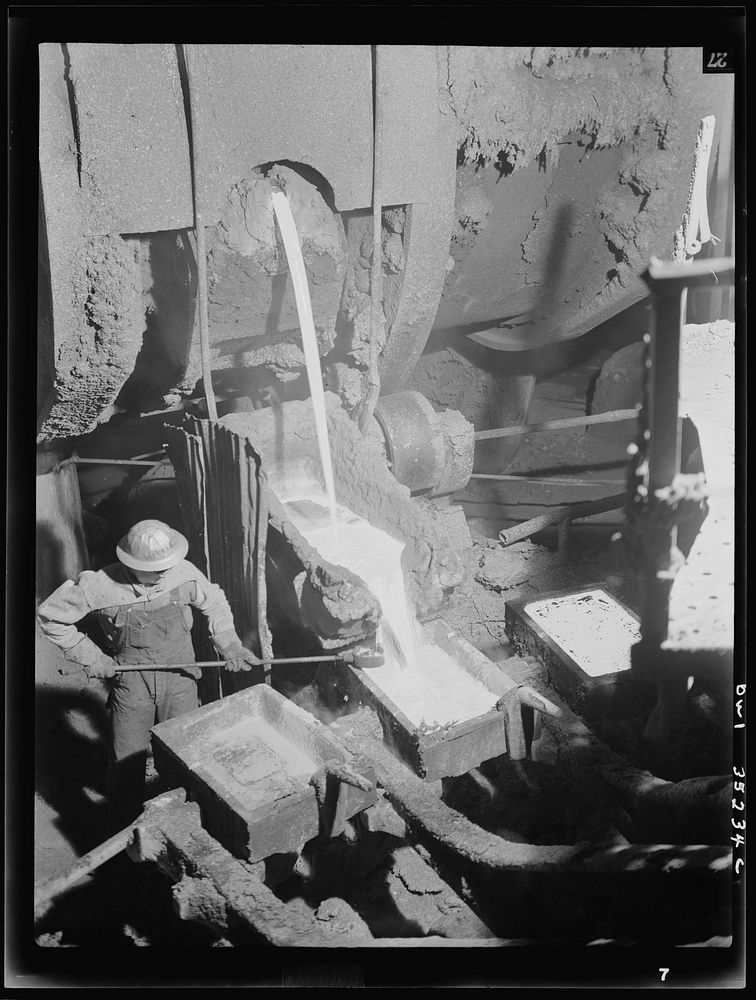 [Untitled photo, possibly related to: Garfield, Utah. Making molds of blister copper at the Garfield smelter of the American…