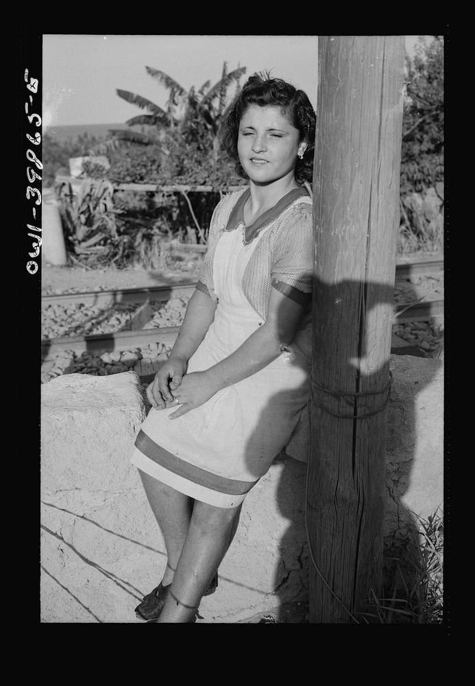 Sicilian girl who tends the gates at the railroad crossing. Sourced from the Library of Congress.
