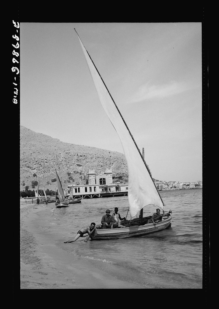Sicilian boys with their sailboat. The people are returning pretty much to normal since the cessation of hostilities.…