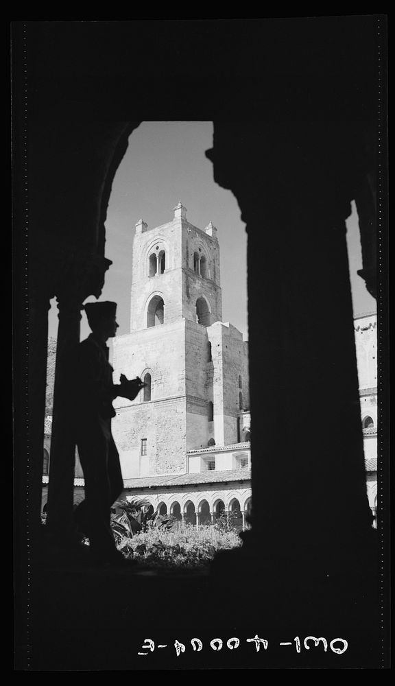 Palermo, Sicily. An American soldier viewing the ancient grandeur of Monreale Cathedral. Sourced from the Library of…