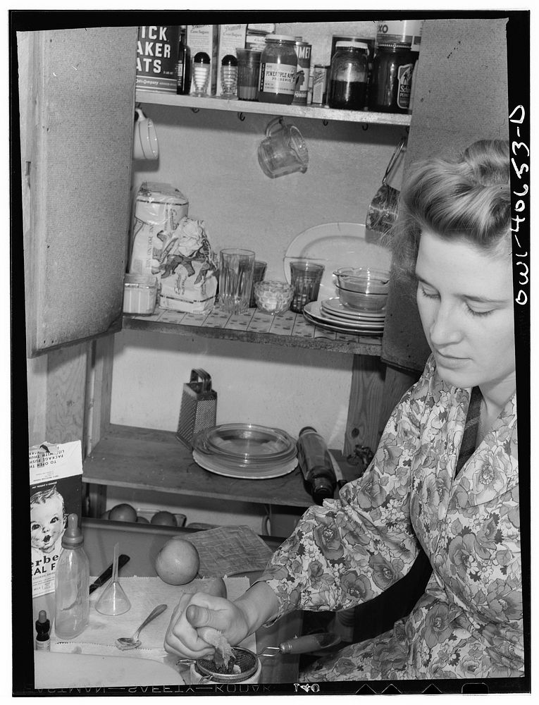 Washington, D.C. Lynn Massman, wife of a second class petty officer who is studying in Washington, squeezing orange juice…