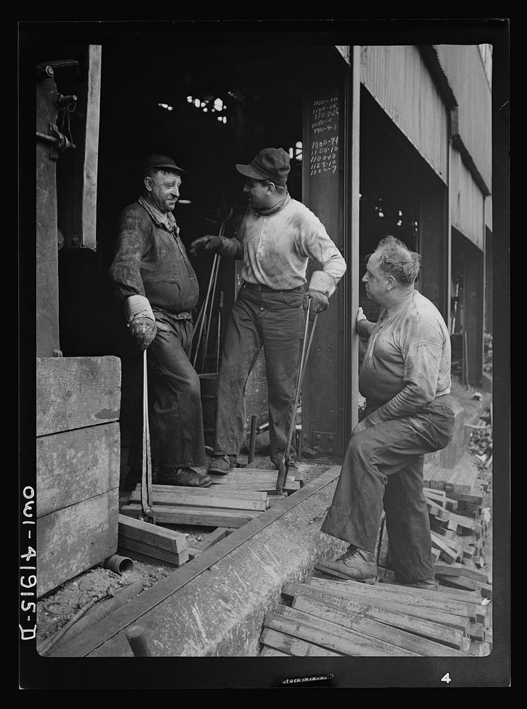 Southington, Connecticut. Workers talking to the foreman. Sourced from the Library of Congress.