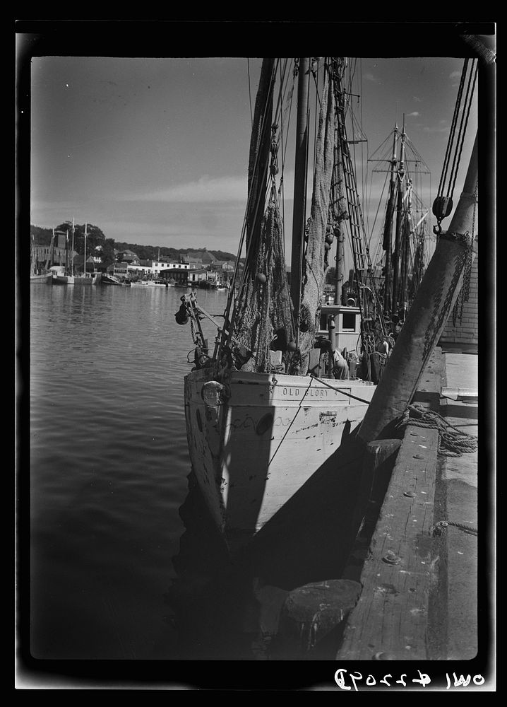 Gloucester, Massachusetts. Heavy nets slide down Old Glory's side at fishing grounds off the New England coast where…