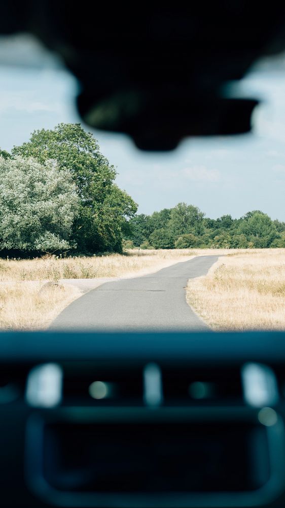 Adventure phone wallpaper background, countryside view through car windscreen